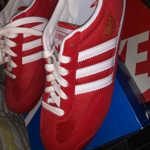 Adidas Red sneakers.